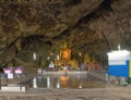 Golden buddha in Tham kra Sae Temple cave in Kanchanaburi province, Thailand near the bridge railway station. Famous tourist