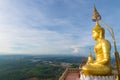 The golden Buddha at the top of mountain, Tiger Cave temple, Krabi, Thailand.