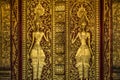 Golden Buddhist door sculpture Royalty Free Stock Photo