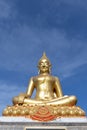 Golden budha image on blue sky background