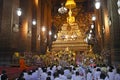 Golden budha image with monk and budhist
