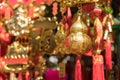 Golden calabash plastic hang for believed to bring luck at Wong Tai Sin Temple with traveler in