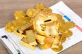 Golden calf piggy bank on gold coins and bars