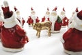 Golden calf, surrounded by Santa Clauses Royalty Free Stock Photo