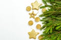 Golden candles and  stars gold colors  with green Christmas tree branches on white background. Copy space Royalty Free Stock Photo