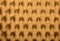 Golden capitone tufted fabric upholstery texture