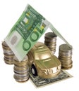 A golden car under garage roof made from banknote Royalty Free Stock Photo