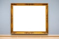 Golden carved picture frame on wall