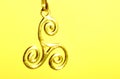 Golden celtic triskele symbol