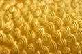 Golden cement plaster in fish skin curve pattern texture wall background