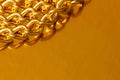 Golden chain. Detail of a yellow iron chain. Metal chain link on the gold background. Decorative jewelry. Luxury design brilliant Royalty Free Stock Photo