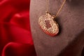 Golden chain with pomegranate shaped pendant, close-up Royalty Free Stock Photo