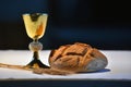 Golden chalice, bread and grapes. Royalty Free Stock Photo