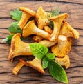 Golden chanterelle mushrooms on the old wooden table