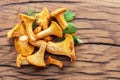 Golden chanterelle mushrooms on the old wooden table