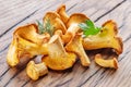 Golden chanterelle mushrooms on the old wooden table