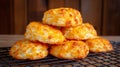 Golden, cheesy biscuits stacked on a cooling rack, ready to be enjoyed Royalty Free Stock Photo
