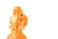 Golden Cherub statue with red heart on an isolated white background. Angel holding a heart of love