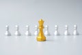 Golden chess king pieces or leader businessman stand out of crowd people of silver men. leadership, business, team, teamwork and Royalty Free Stock Photo