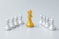 Golden chess king pieces or leader businessman stand out of crowd people of silver men. leadership, business, team, teamwork and