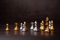 Golden Chess King standing to Be around of other chess, Concept of a leader must have courage and challenge in the competition, Royalty Free Stock Photo