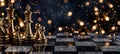 Golden chess pieces on board with festive bokeh lights strategic gameplay concept with copy space Royalty Free Stock Photo