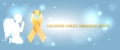 Golden childhood awareness ribbon symbol shining over steel blue background with magic lights and a profile of a praying kneeling