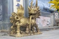 Golden Chinese Kirin guardian statue in front of temple Royalty Free Stock Photo