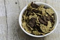 Golden and chocolate cornflakes in a bowl on the wooden table Royalty Free Stock Photo