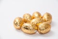 Golden chocolate easter egg on the white background Royalty Free Stock Photo