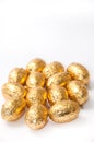 Golden chocolate easter egg on the white background Royalty Free Stock Photo