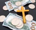 Golden Christianity cross with money, coins and paper cash bill