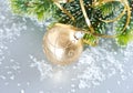 Golden christmas ball with christmas tree branch Royalty Free Stock Photo