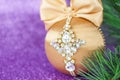 Golden Christmas ball in rhinestones for decorating the Christmas tree. Christmas toy. Christmas toy for decorating a Christmas