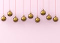 Golden Christmas balls ornaments on pink background.New Year`s Eve decoration golden red shiny convolution lines hanging adornmen Royalty Free Stock Photo