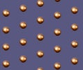 Golden Christmas balls pattern on violet background