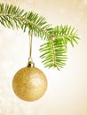 Golden christmas bauble on a string Royalty Free Stock Photo