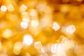 Golden Christmas Bokeh Background. Gold Holiday glowing Abstract Glitter Defocused Royalty Free Stock Photo