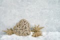 Golden Christmas decoration in snow on gray background. Copy spa Royalty Free Stock Photo