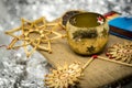 Golden Christmas decoration with straw stars, candlesticks and matche