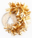 Golden christmas decoration with wooden carved tree