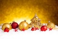 Golden christmas fir tree decoration with gold and red ornaments Royalty Free Stock Photo