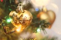 Golden Christmas heart hanging on the Christmas tree Royalty Free Stock Photo