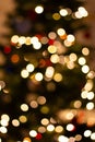 Golden Christmas lights, unfocused. Glowing lights, defocused. Winter holidays magic. Golden stardust lights.