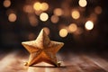 Golden Christmas Star with Bokeh Light Blurred Background