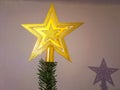 Golden Christmas Star isolated on white Background. Top View Close-Up Gold Star Royalty Free Stock Photo