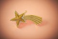 Golden christmas star onlight brown background Royalty Free Stock Photo