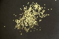 Golden Christmas stars on black background. Golden glitter texture abstract background. Royalty Free Stock Photo