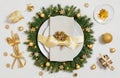 Golden Christmas table setting on white background. New Year serving. Christmas dinner. Top view, flat lay Royalty Free Stock Photo