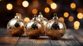 Golden Christmas tree balls on a wooden table, side view Royalty Free Stock Photo
